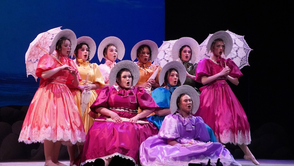 Costumed performance group on stage