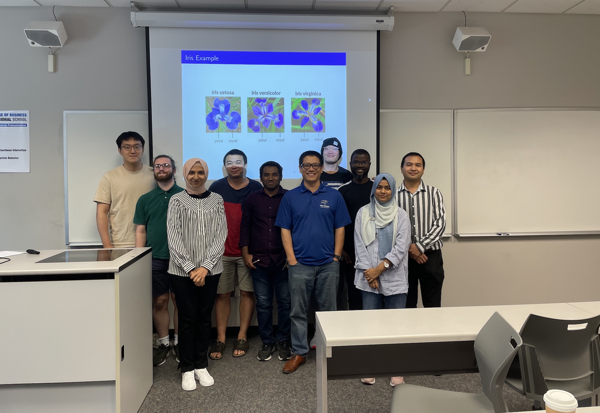 Mathematics Statistics and Data Analysis class in front of projector screen